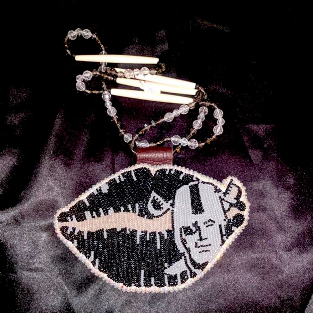 Handmade beadwork NFL Raiders kiss medallion